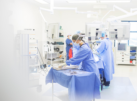 Image of surgeons performing surgery in an operational theater
