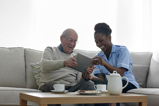 Nurse and patient bond over tablet