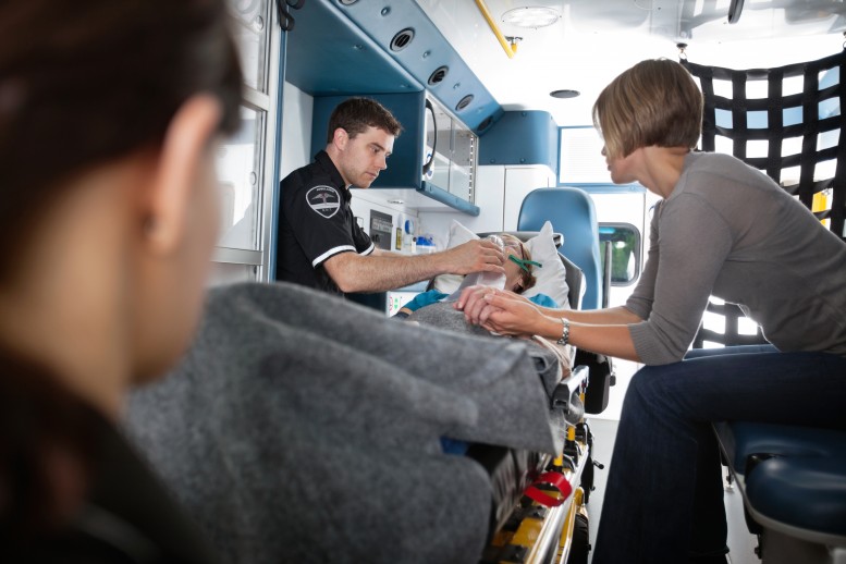 EMS helping a patient in an ambulance