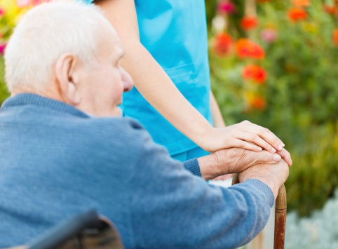 Patient in chair with caregiver