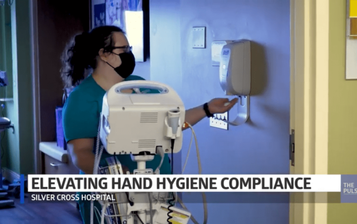 nurse sanitizing hands
