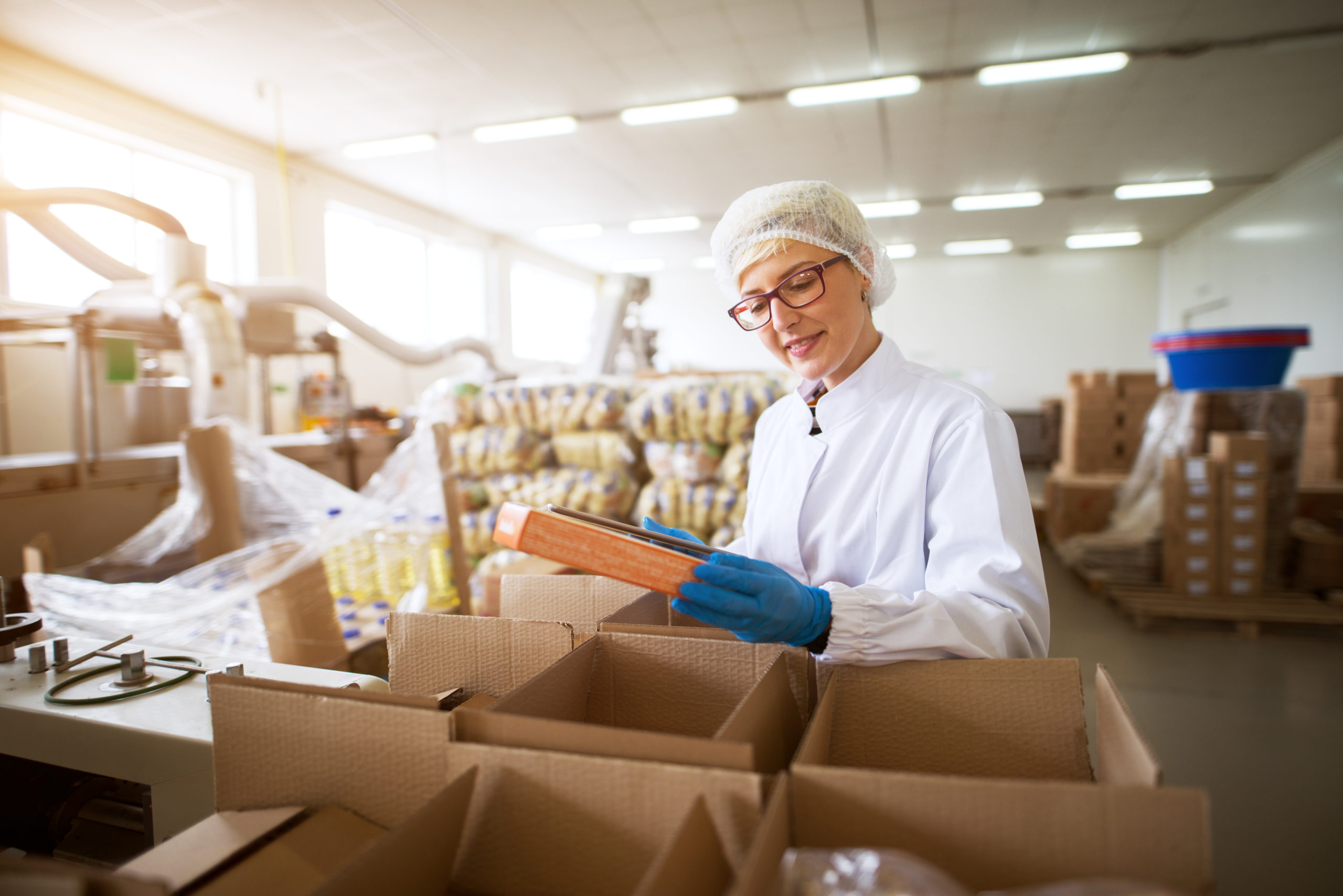 Worker packing food products
