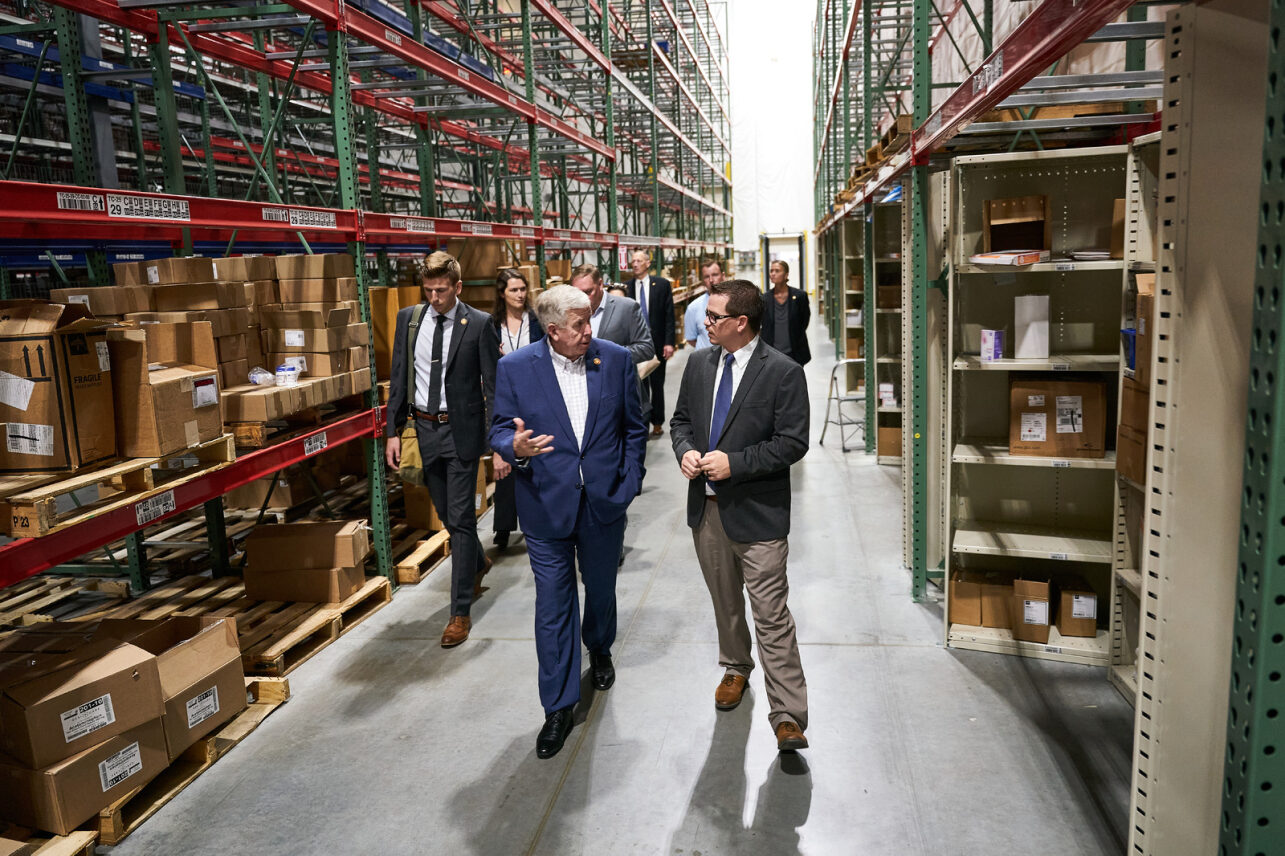 Governor Parson and Medline Operations Director Andrew Krohn tour new St. Peters distribution center