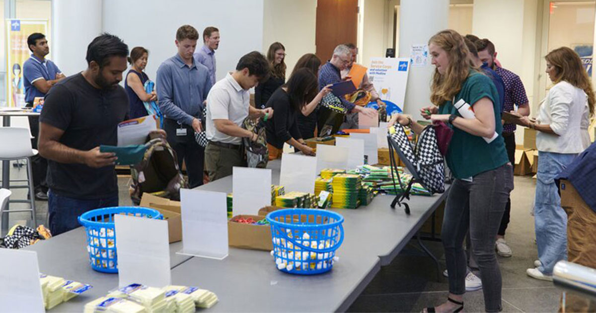 More than 200 Medline volunteers packed 450 new backpacks for the children of Lake County