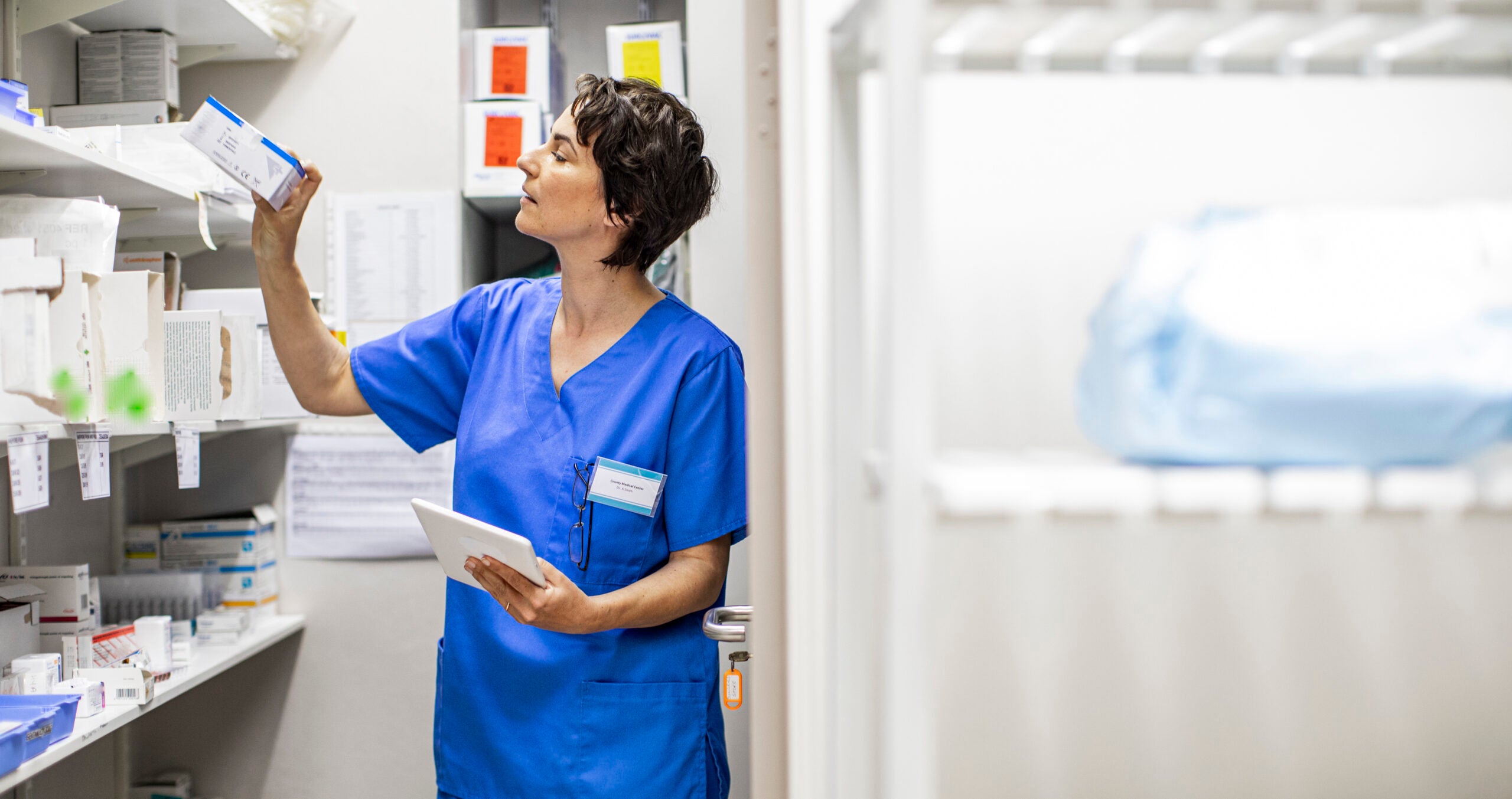 Young female doctor doing a medical supplies inventory in a hospital