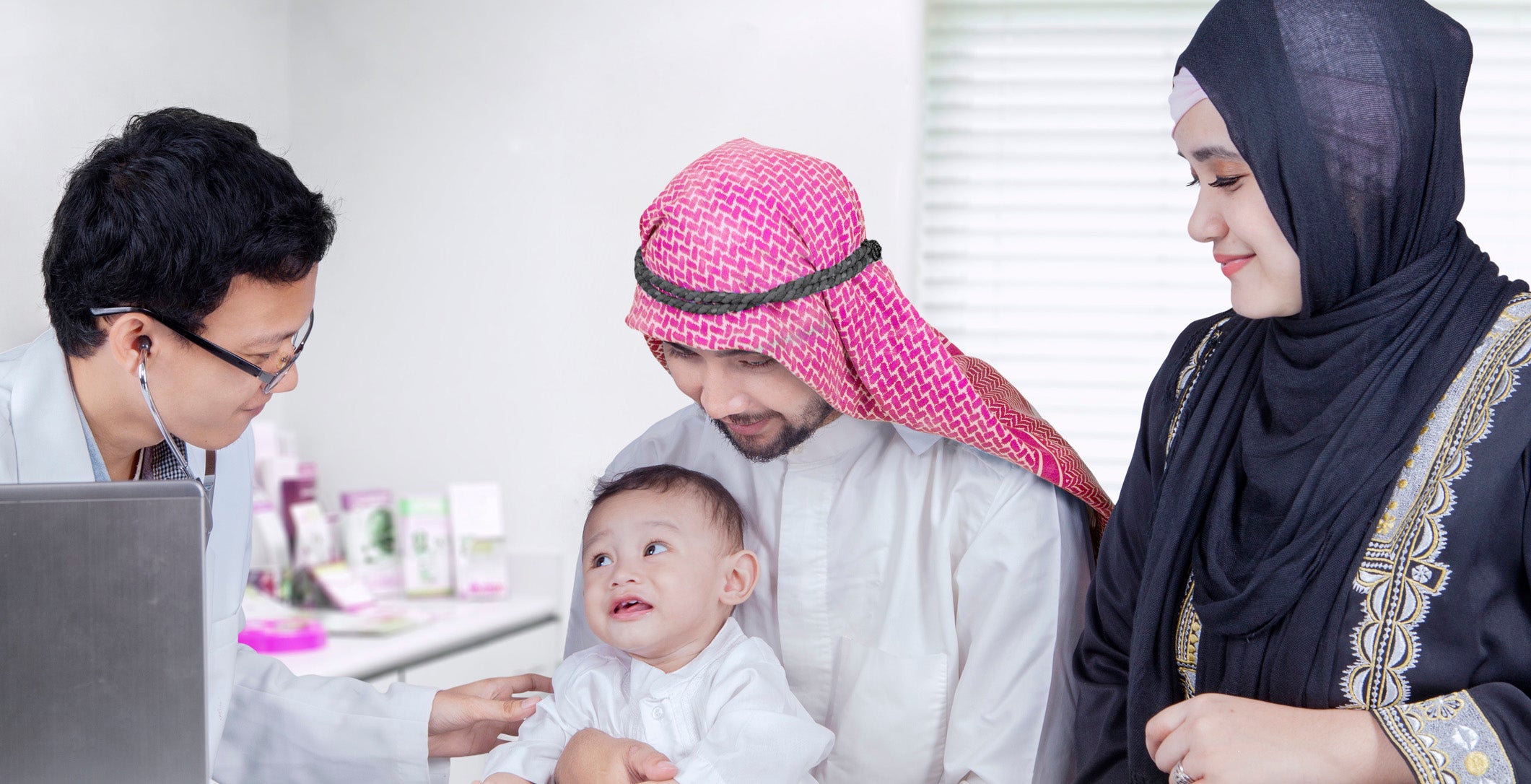 Arabic little boy visit doctor with his parents